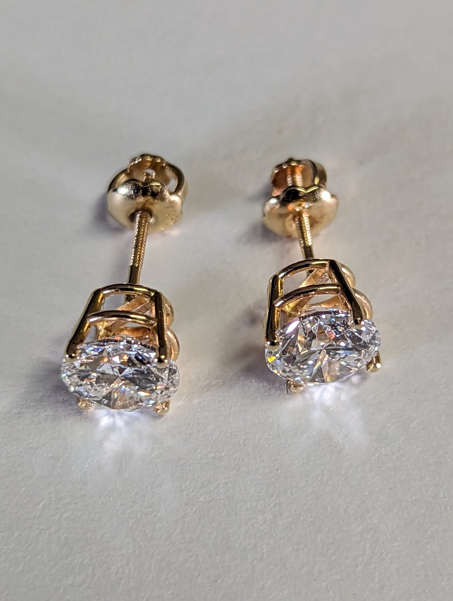 1 carat each stud Lab diamonds.. 14k yellow gold