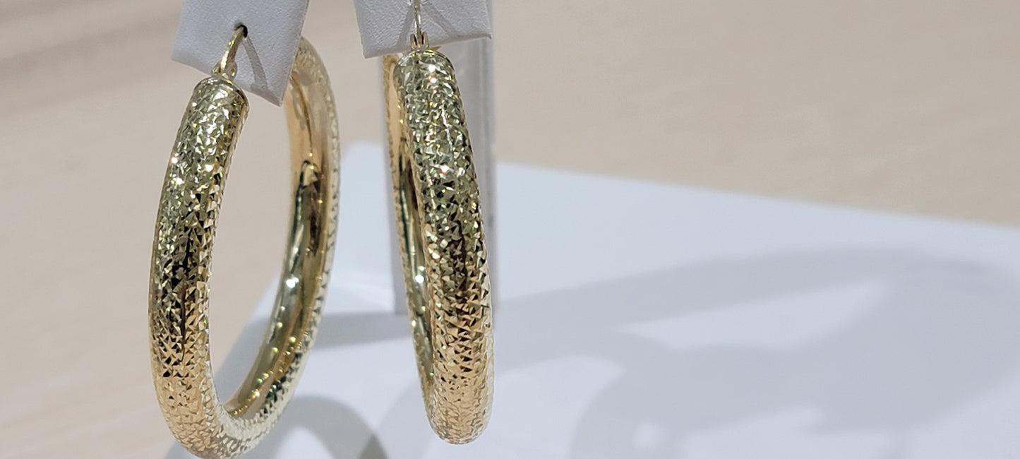 10kt Gold Earrings. fancy cut hollow hoops
