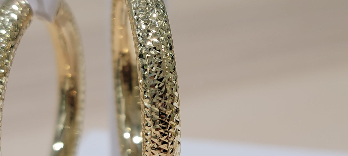 10kt Gold Earrings. fancy cut hollow hoops
