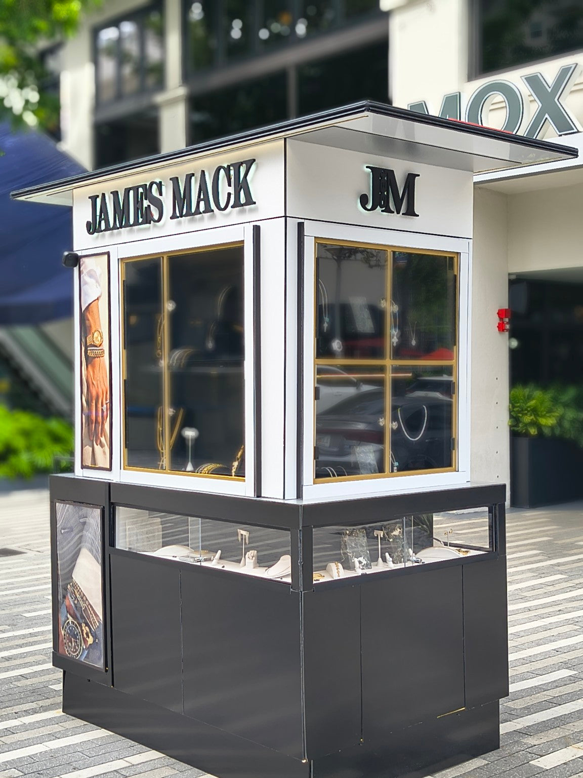 James Mack Studio One jewelry boutique kiosk at Mary Brickell Village with illuminated signage and display windows