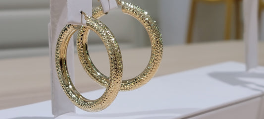 10kt Gold Earrings. fancy cut hollow hoops