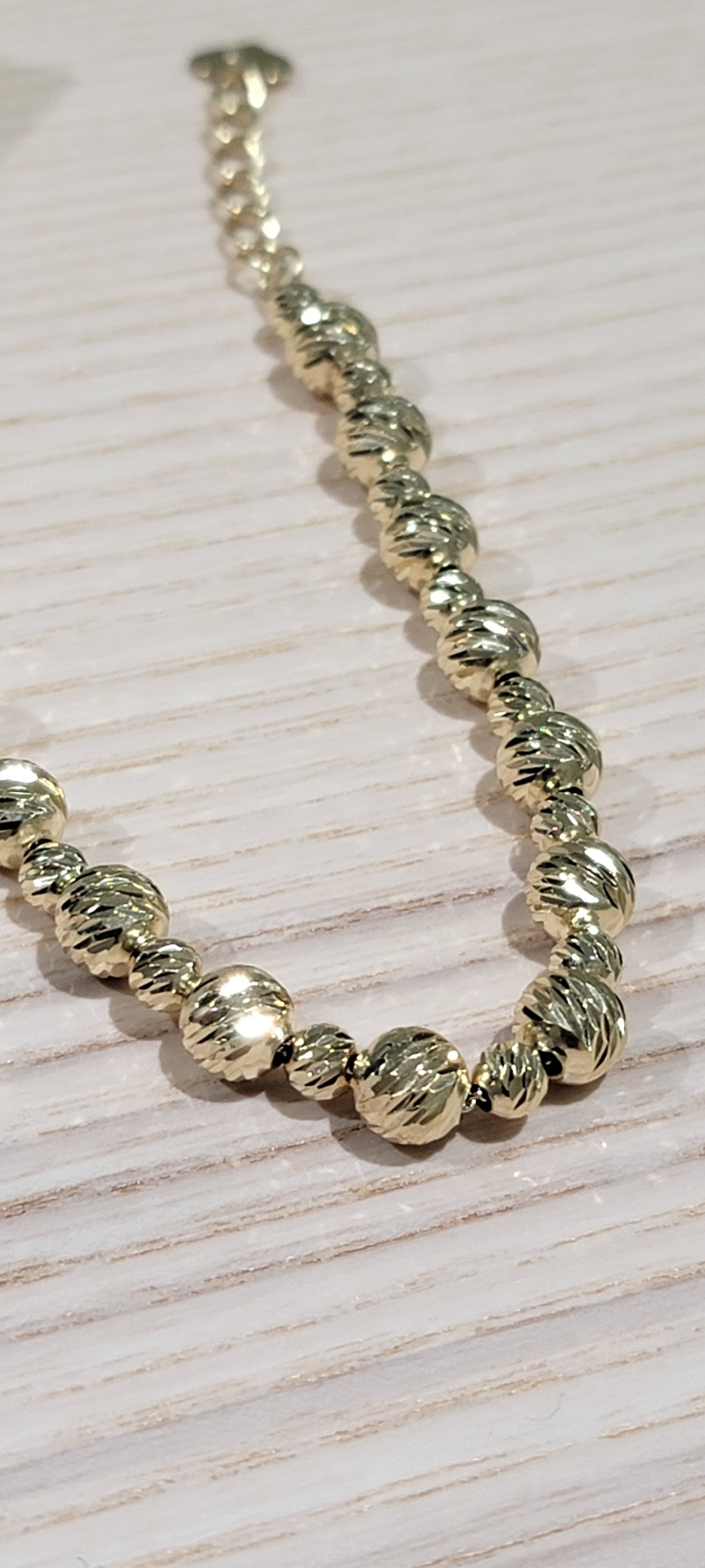 14kt gold fancy bracelet adjustable from 7 inch to 9 inches
